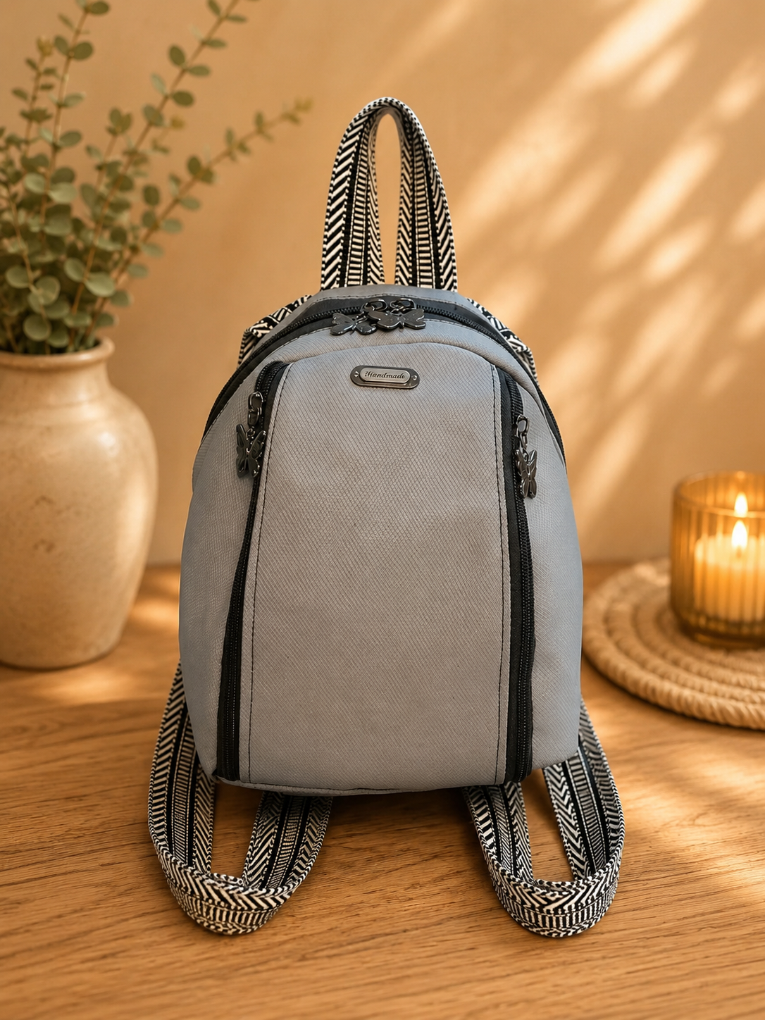 handmade gray vinyl small backpack features front view
