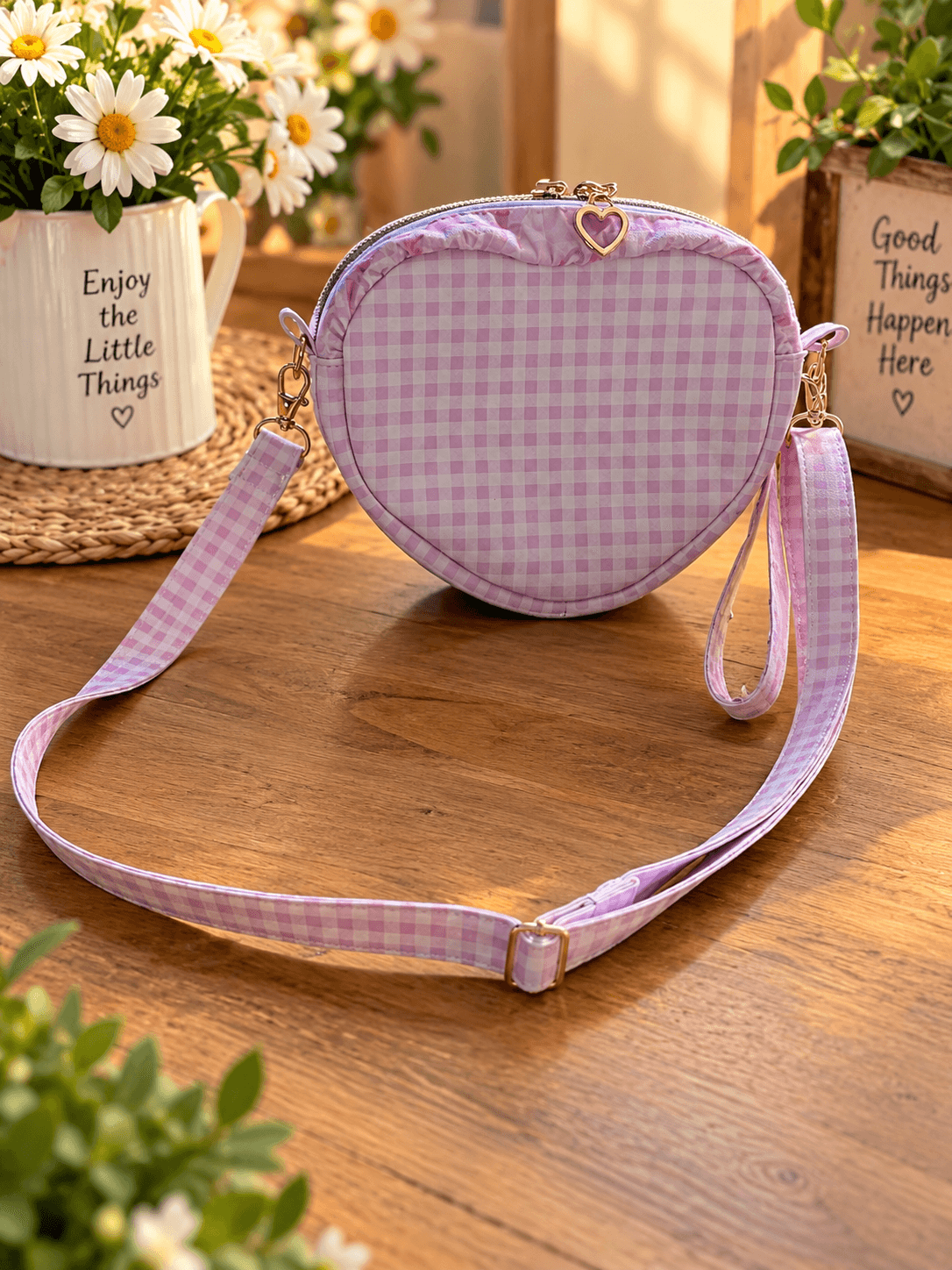 Pink and white gingham heart bag with a heart-shaped zipper pull, adjustable matching shoulder strap and wrist strap.