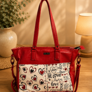 red vinyl heart print handbag front view