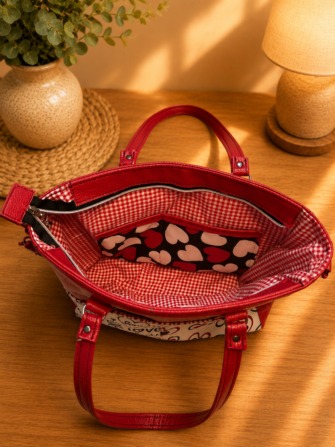 red vinyl heart print handbag interior pocket view