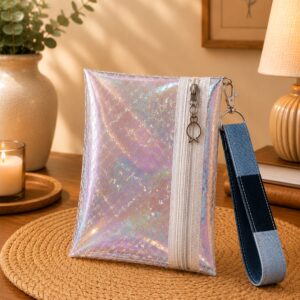 Iridescent patterned wristlet with fish zipper charm, white zipper and blue patchwork wrist strap.